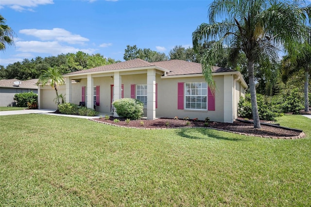 view of front of house with a garage and a front lawn