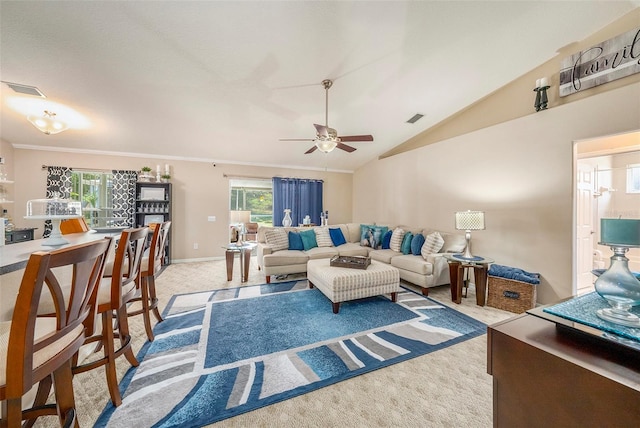 carpeted living room featuring ceiling fan, ornamental molding, and vaulted ceiling