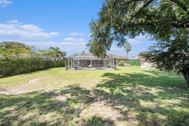 view of yard with a lanai