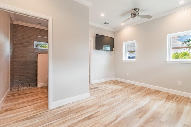 empty room featuring ceiling fan, ornamental molding, brick wall, and light hardwood / wood-style floors