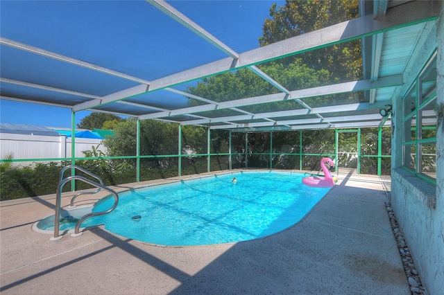 view of pool with a fenced in pool, a lanai, and a patio area