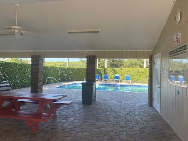 view of swimming pool with ceiling fan