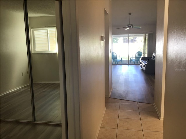 hallway featuring light tile patterned flooring