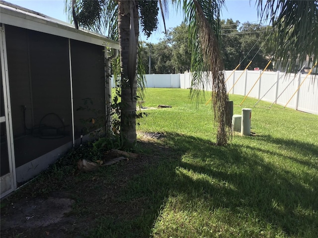 view of yard with a sunroom