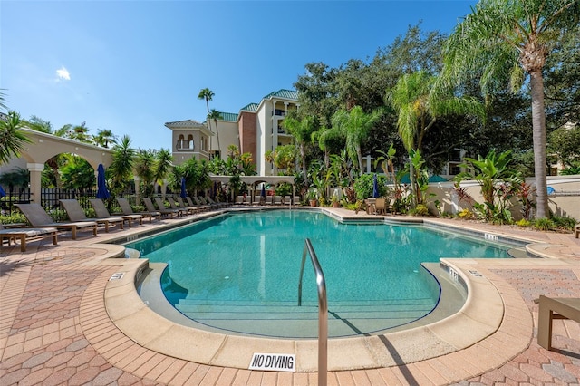 view of pool featuring a patio