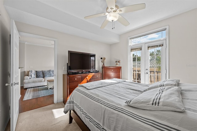 carpeted bedroom featuring french doors, access to outside, and ceiling fan