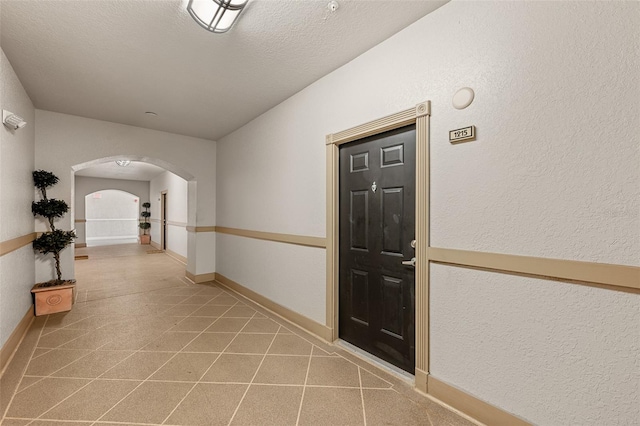 interior space with a textured ceiling