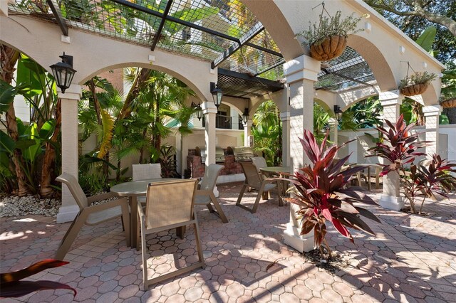 view of patio featuring a pergola and exterior kitchen