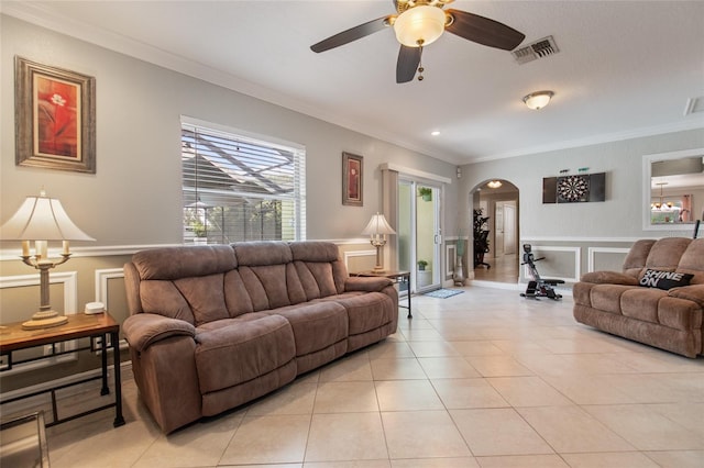 tiled living room featuring crown molding and ceiling fan