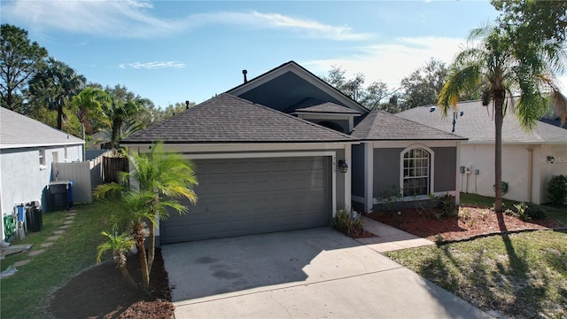 view of front facade with a garage and a front lawn