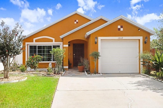 ranch-style house with a garage and a front lawn