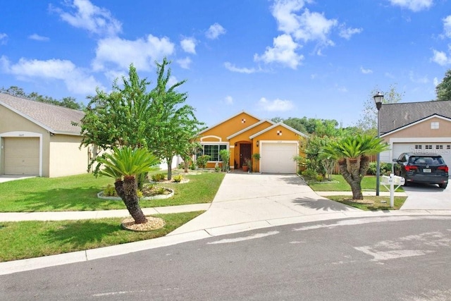 view of front facade with a garage and a front yard