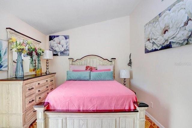 bedroom with lofted ceiling