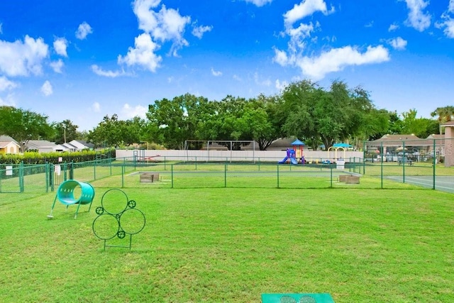 view of home's community featuring a lawn