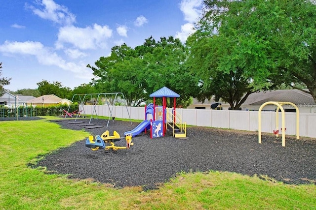 view of jungle gym featuring a lawn