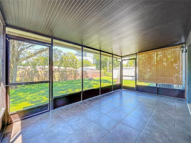 unfurnished sunroom with a healthy amount of sunlight