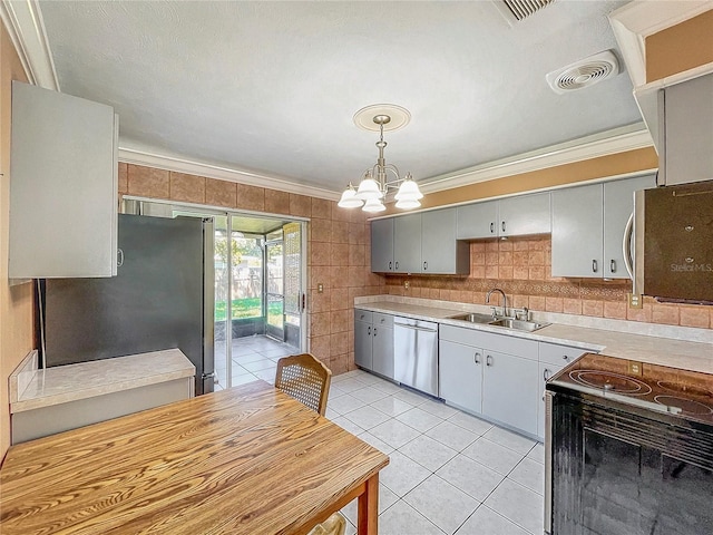 kitchen with decorative light fixtures, gray cabinets, stainless steel appliances, an inviting chandelier, and crown molding