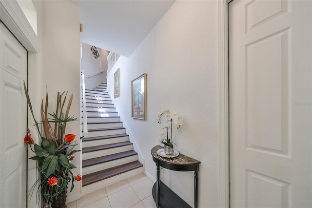 stairs with tile patterned floors