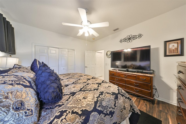 bedroom featuring a closet, ceiling fan, and dark hardwood / wood-style flooring