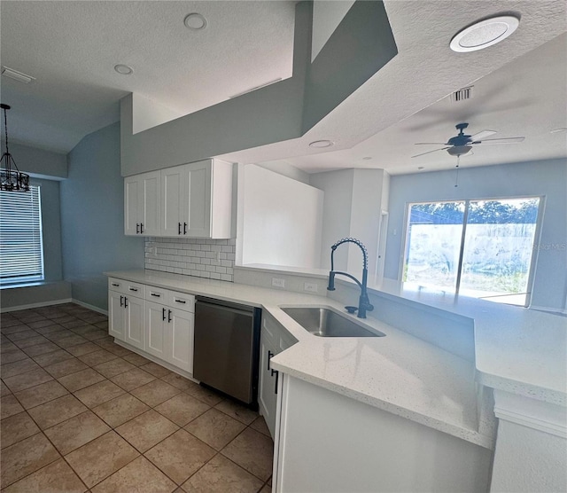 kitchen featuring decorative backsplash, white cabinetry, a sink, light stone countertops, and dishwasher