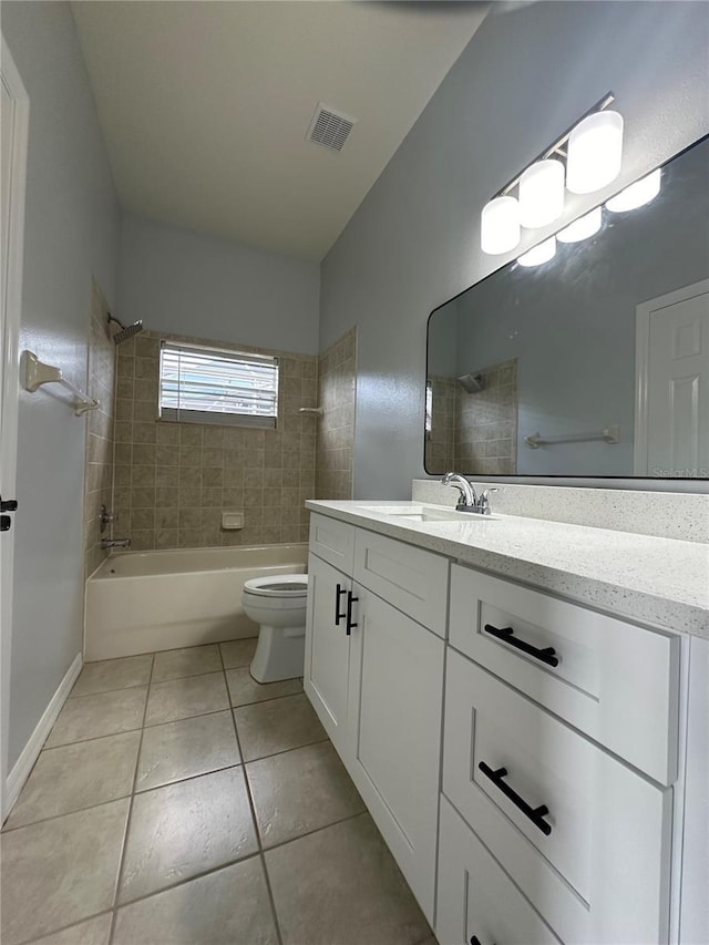 bathroom with tile patterned flooring, toilet, vanity, visible vents, and shower / washtub combination