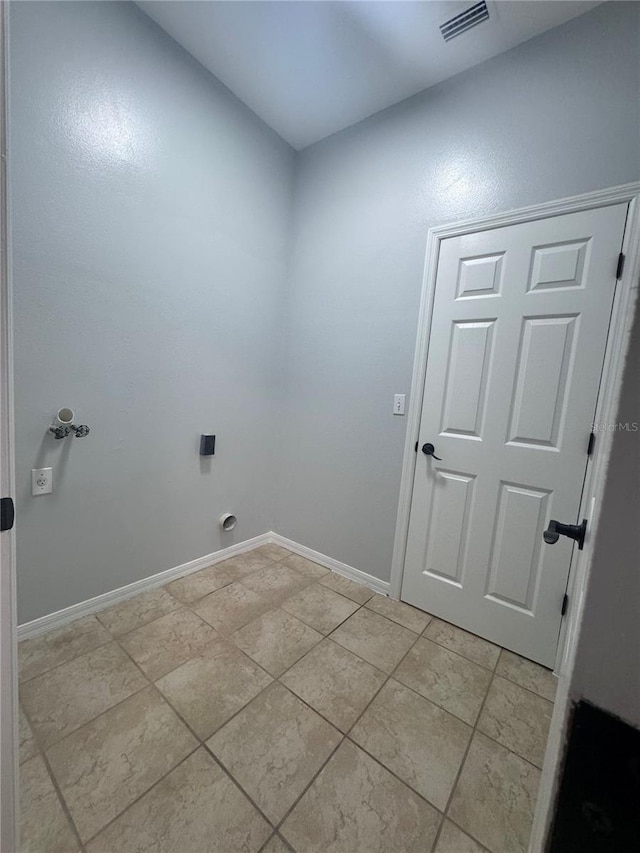 clothes washing area featuring laundry area, visible vents, and baseboards