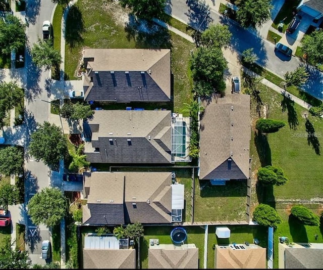 birds eye view of property with a residential view