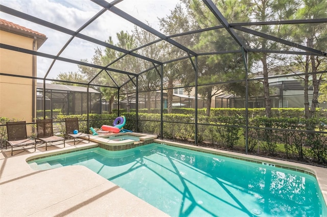 view of swimming pool featuring an in ground hot tub, a lanai, and a patio area