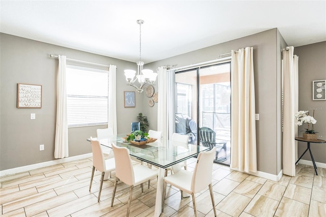 dining room featuring light hardwood / wood-style flooring and a chandelier