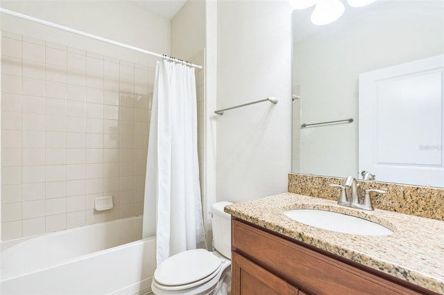 full bathroom featuring shower / tub combo with curtain, vanity, and toilet