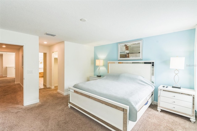 carpeted bedroom with a textured ceiling