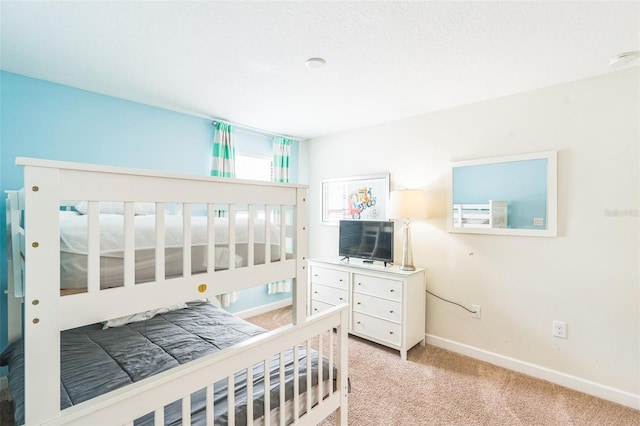 bedroom featuring light colored carpet