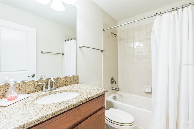 full bathroom featuring vanity, toilet, and shower / bath combination with curtain