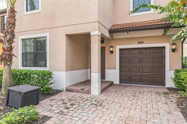 property entrance featuring a garage