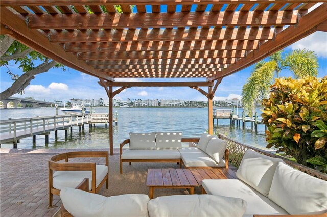 dock area featuring an outdoor hangout area, a water view, and a pergola