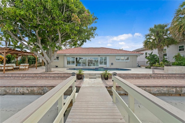 rear view of property featuring a patio area