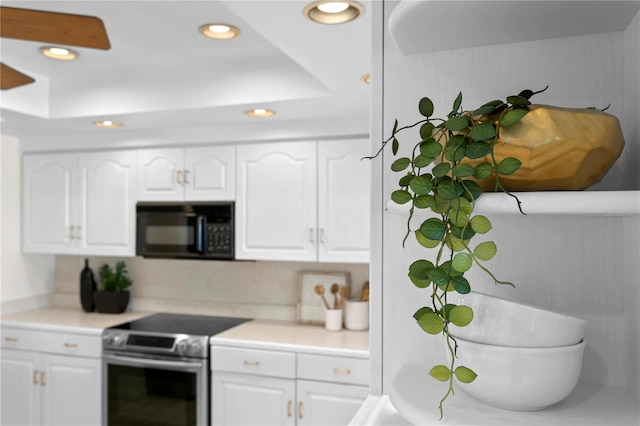 kitchen with white cabinetry and stainless steel range with electric cooktop