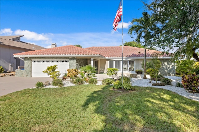 view of front of home featuring a front lawn and a garage