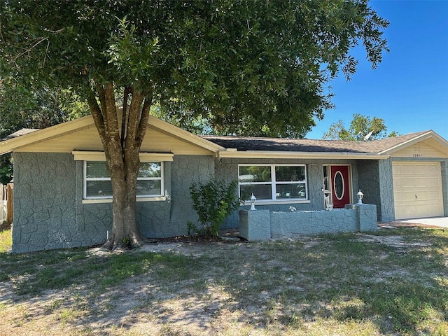 single story home with a garage