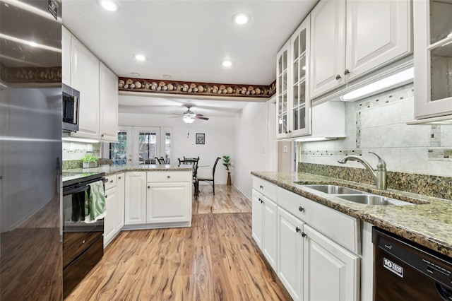 kitchen with black appliances, light hardwood / wood-style floors, ceiling fan, and white cabinets