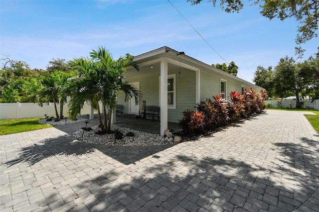 view of side of home featuring a patio