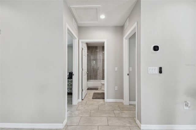 corridor featuring light tile patterned floors