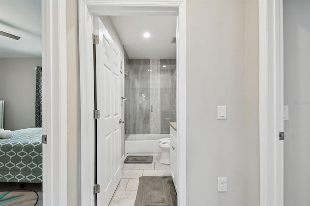 bathroom with tile patterned flooring, vanity, and toilet