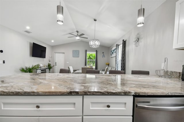 kitchen featuring ceiling fan, white cabinets, lofted ceiling, stainless steel dishwasher, and light stone countertops