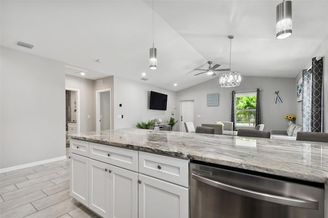 kitchen featuring light stone counters, ceiling fan, stainless steel dishwasher, white cabinets, and vaulted ceiling