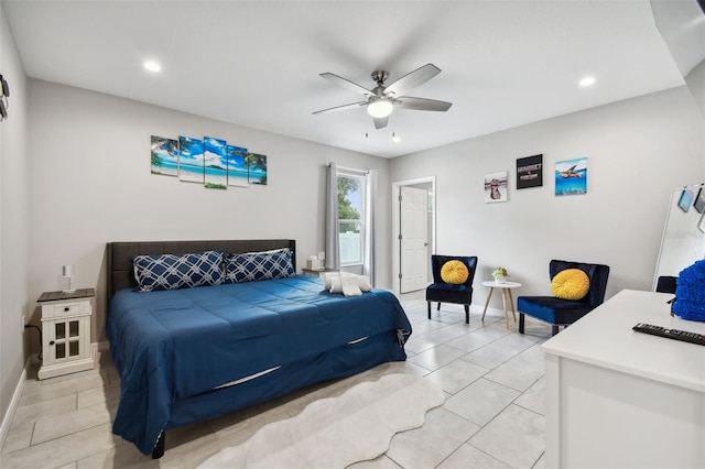 tiled bedroom featuring ceiling fan