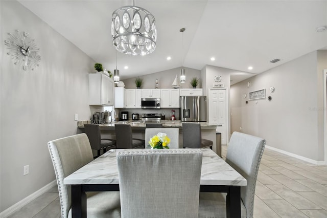 dining space featuring light tile patterned flooring, lofted ceiling, sink, and a chandelier