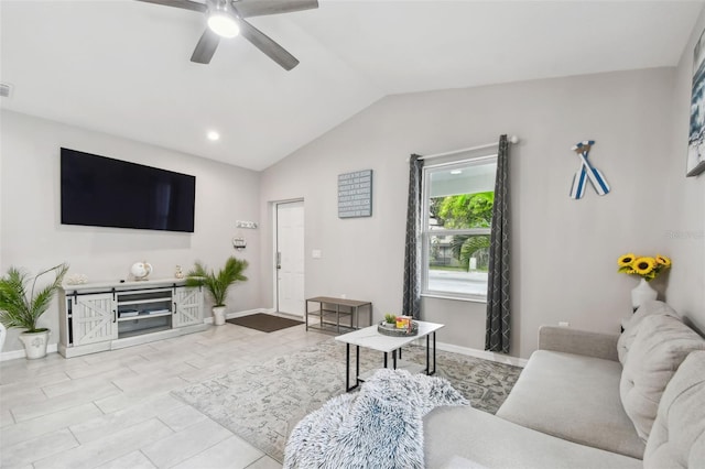 living room featuring vaulted ceiling and ceiling fan