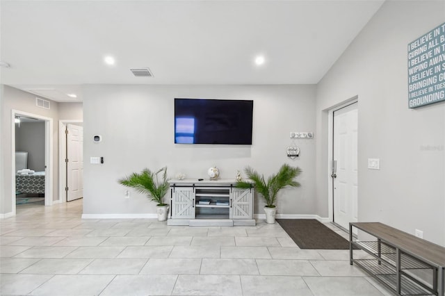 living room featuring light tile patterned flooring