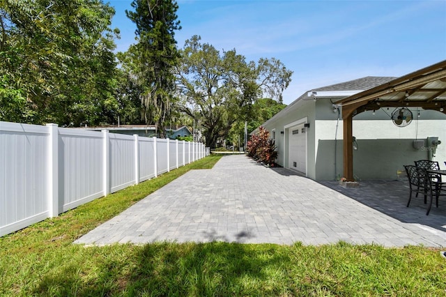 view of patio / terrace with a garage